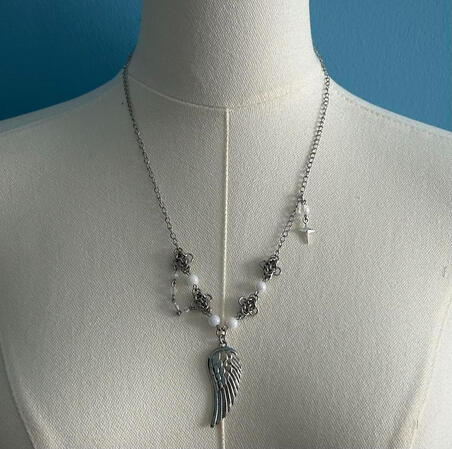 | White Angel Wing Necklace | $20 |